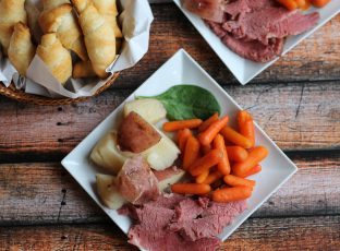 Slow-cooked a corned beef brisket with red potatoes, carrots and crescent rolls
