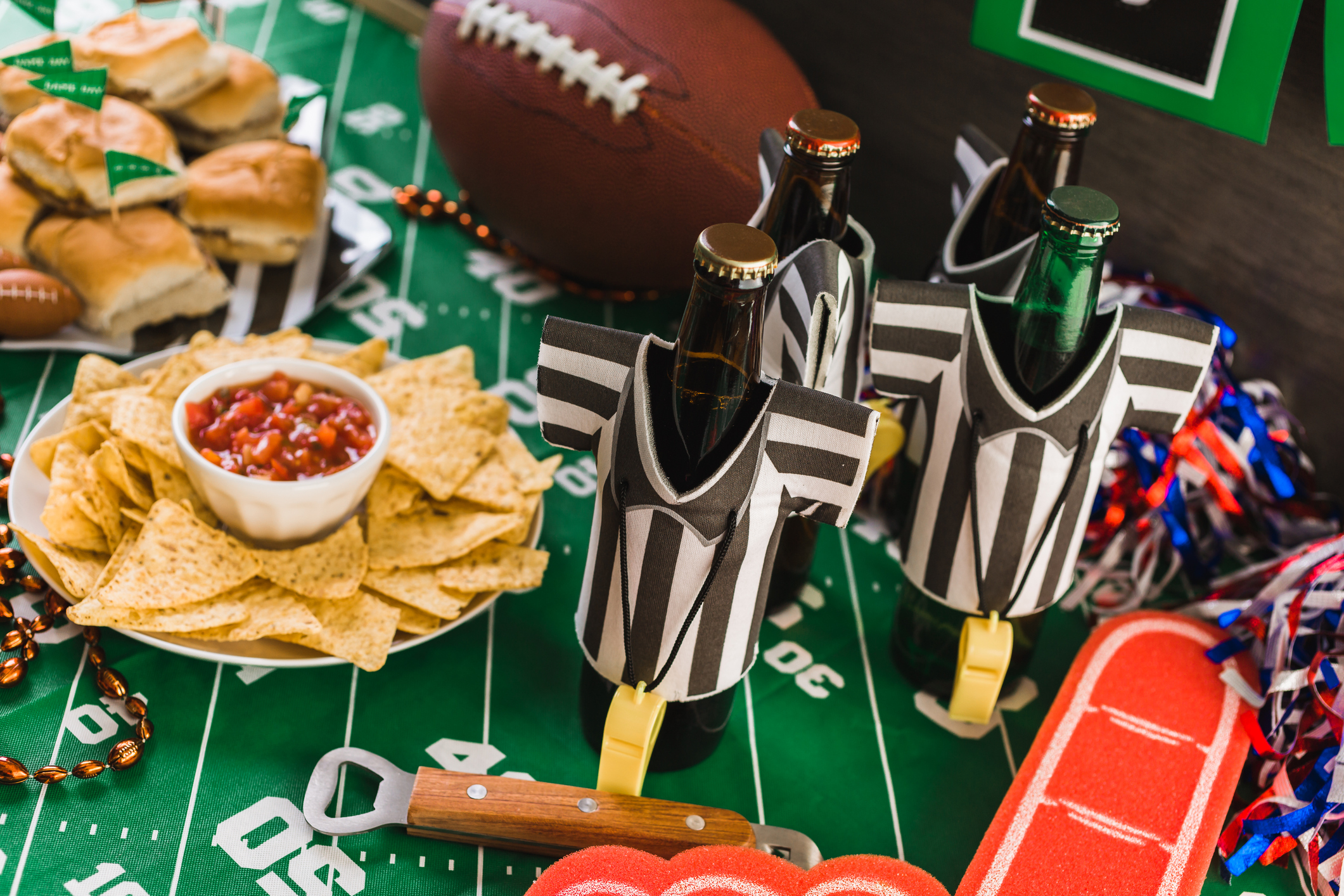 Game day football party table with beer, chips and salsa.