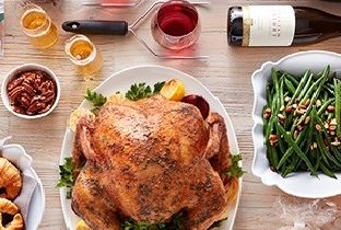 An ALDI Thanksgiving spread including turkey, green beans and croissants.
